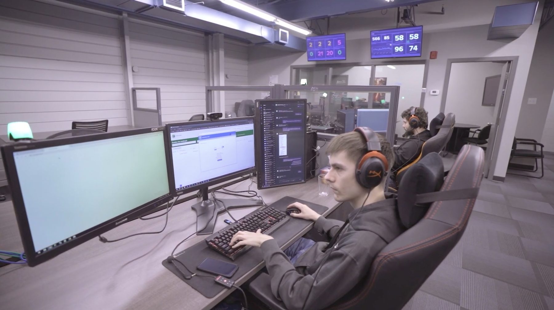 The GOX floor: people at their desks, screens on.